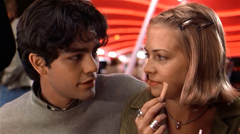 Adrian Grenier smiling at Melissa Joan Hart