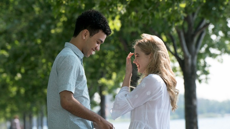 Justice Smith smiling at Angourie Rice