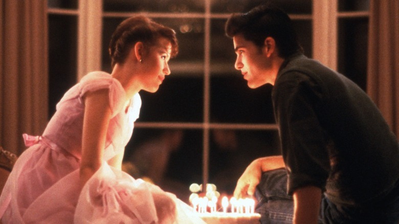 Molly Ringwald smiling at Michael Schoeffling