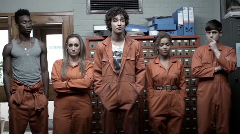 Misfits kids wearing orange jumpsuits