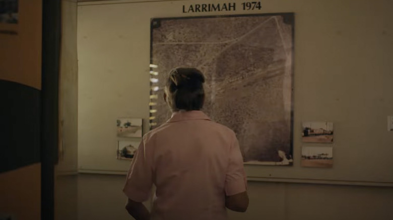 Man looks at map of Larrimah