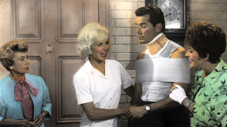 James Garner wears a neck brace