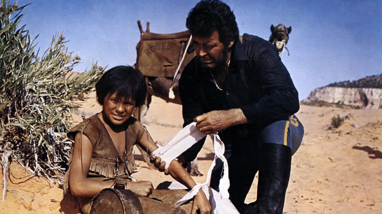 James Garner bandages an arm