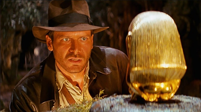 Indiana Jones looking at the idol