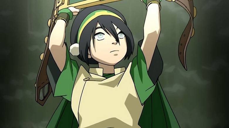 Toph brandishing her belt