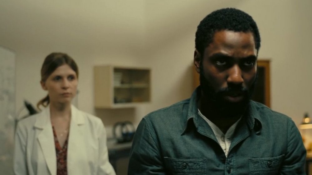 Clémence Poésy and John David Washington as Laura and The Protagonist