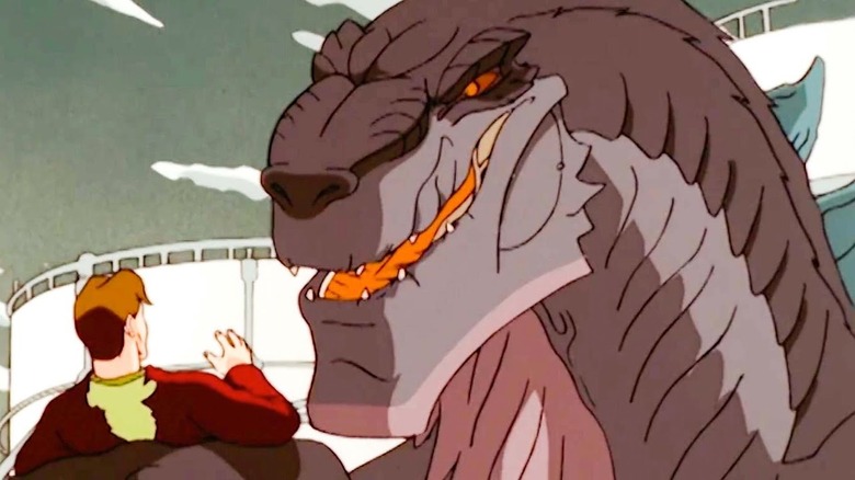 Godzilla snarling at a little man