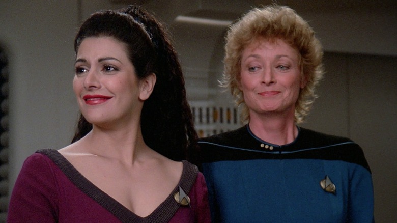 Troi and Pulaski smile