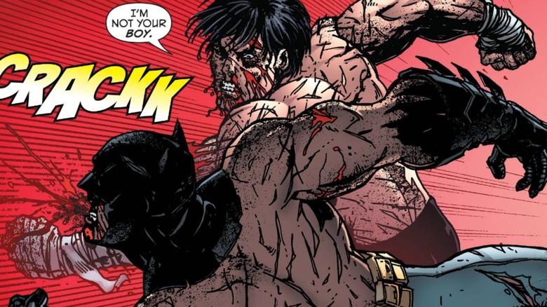 Nightwing punching Batman