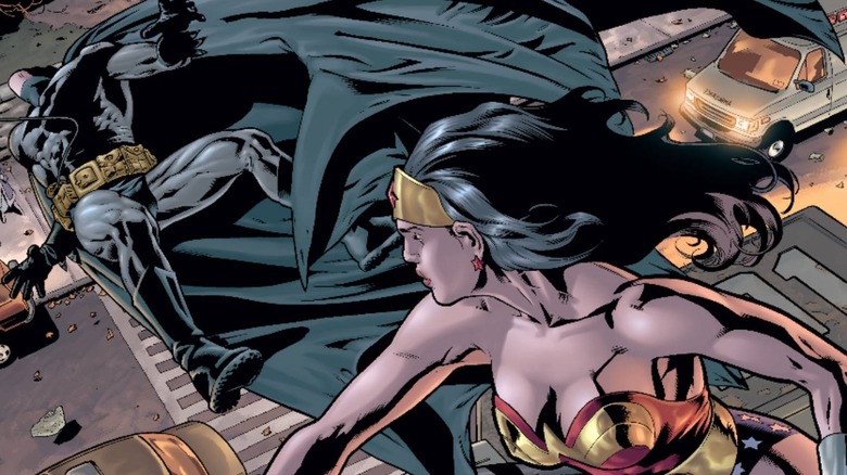 Wonder Woman punching Batman