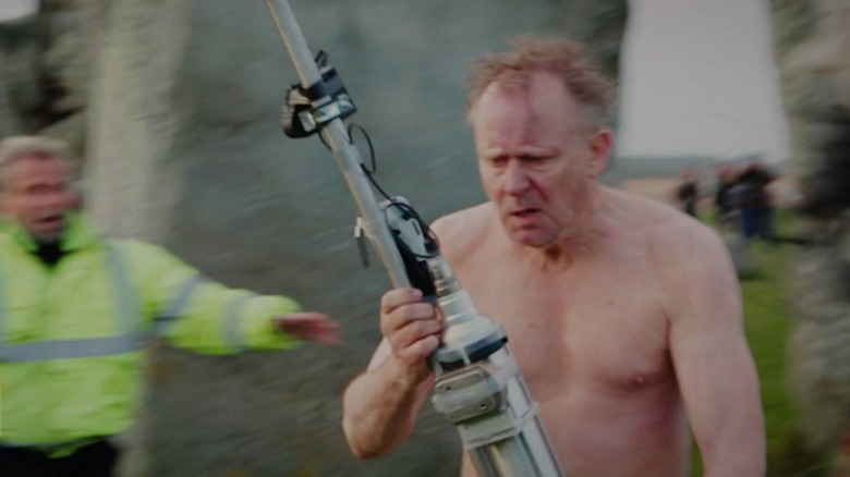 Erik Selvig shirtless holding equipment