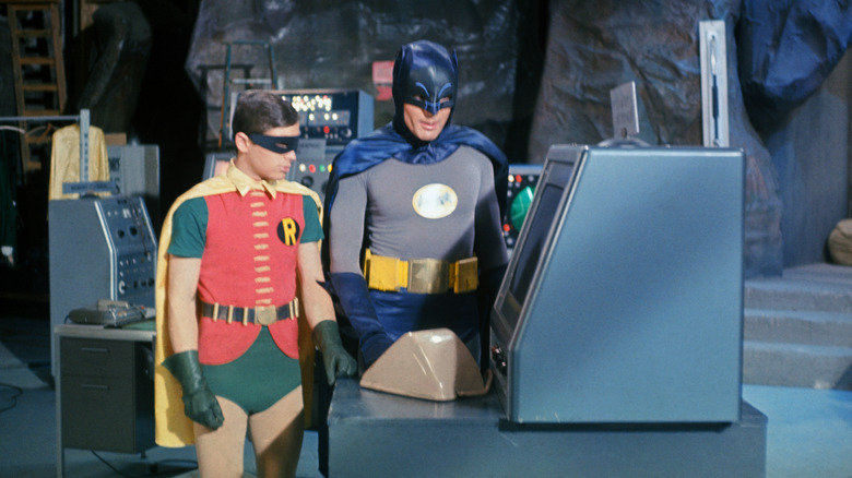 Batman and Robin looking at computer 