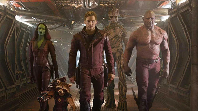 Starlord, Drax, Gamora, Rocket, and Groot walk down a hallway