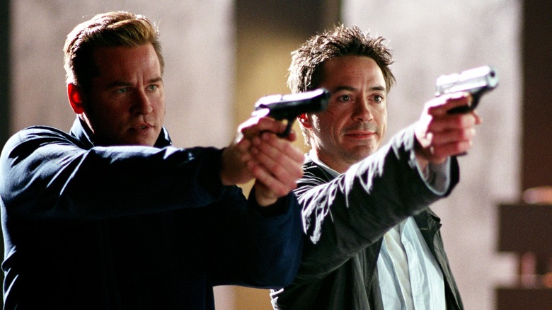 Kilmer and Downey Jr. point guns