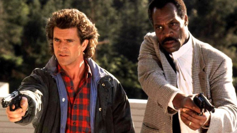 Riggs and Murtaugh aim their guns