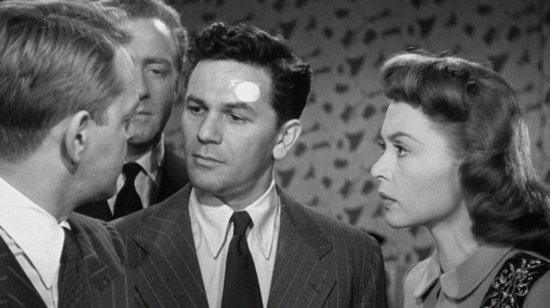 John Garfield talks with others