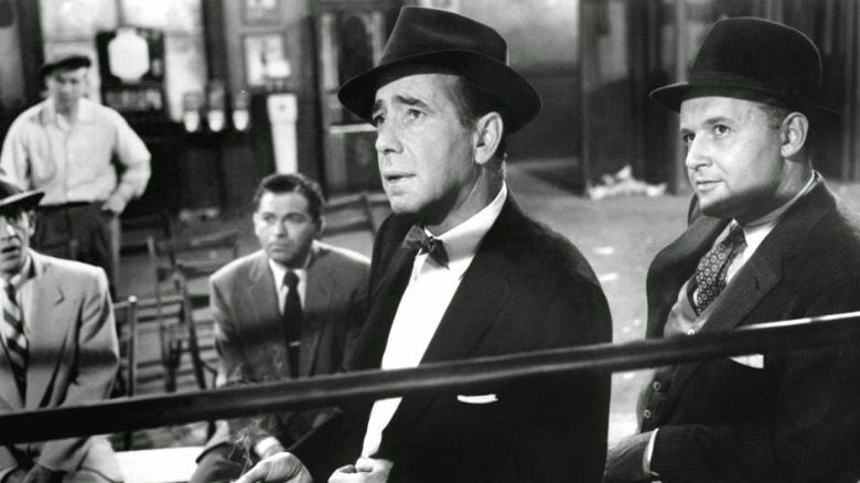 Humphrey Bogart ringside in suit and hat