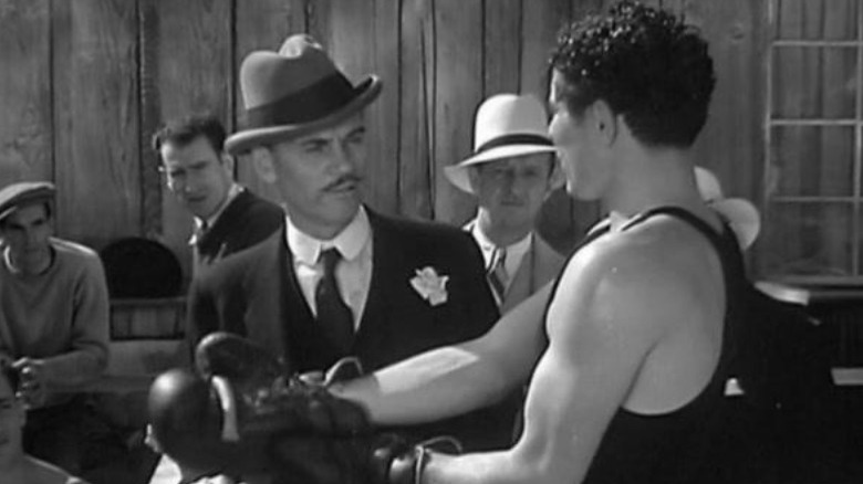 Max Baer and Walter Huston talking