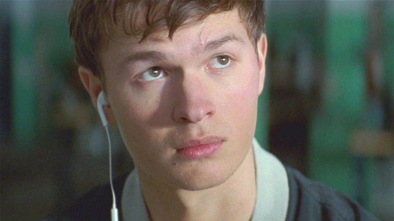 Baby Driver in close-up, with one earbud in