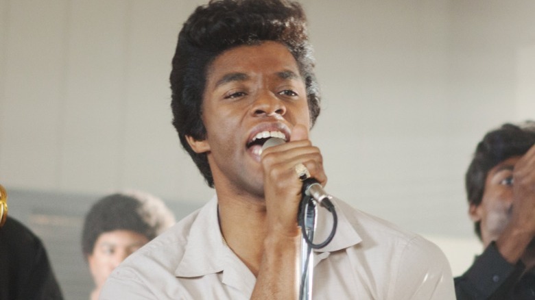 James Brown singing passionately in close-up