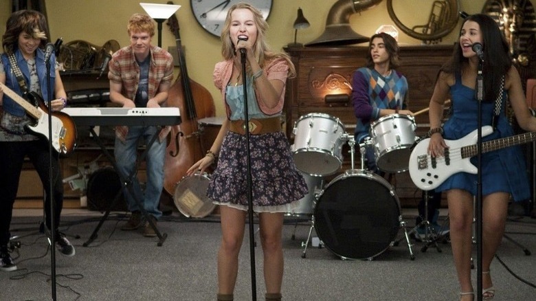 The band Lemonade Mouth performing in a music classroom