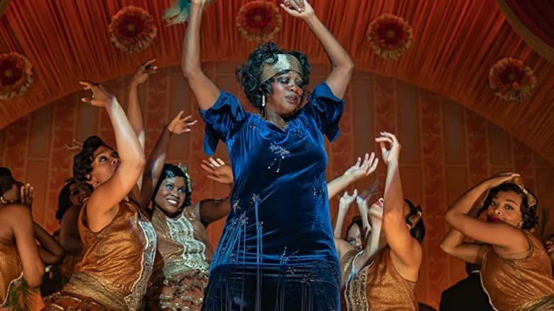 Ma Rainey dancing, surrounded by other dancers on stage