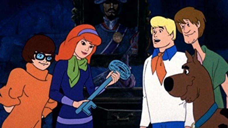 The Mystery Gang examining a clue