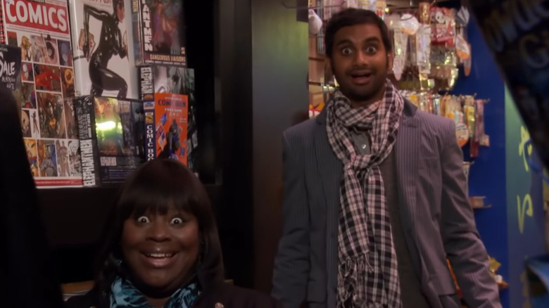 Aziz Ansari and Retta look excited