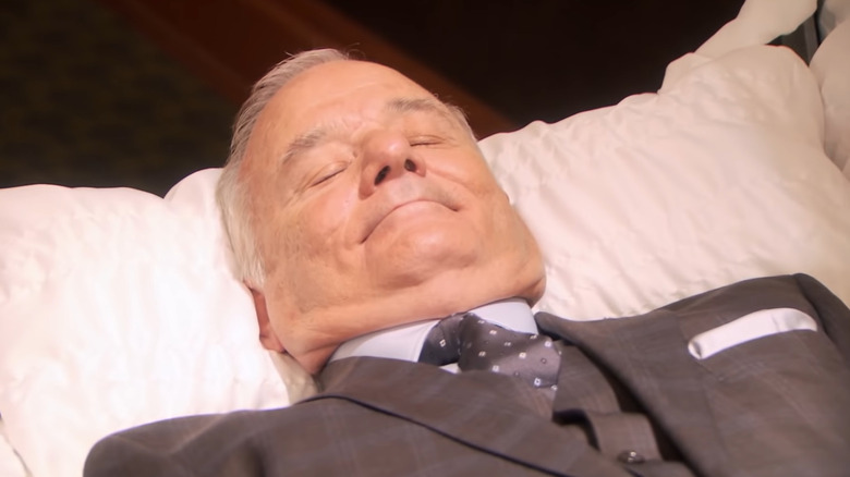 Billy Murray lies in a casket