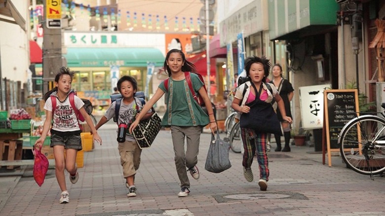 Kids running in Tokyo street  