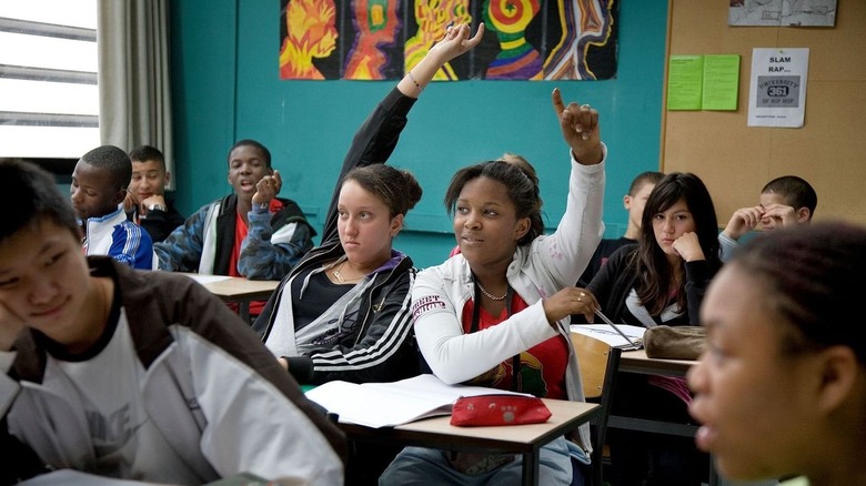 Students raising their hands