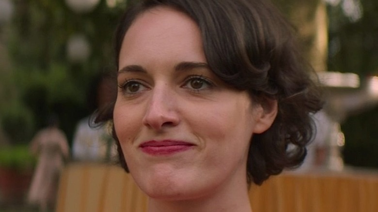 Fleabag smiling tightly