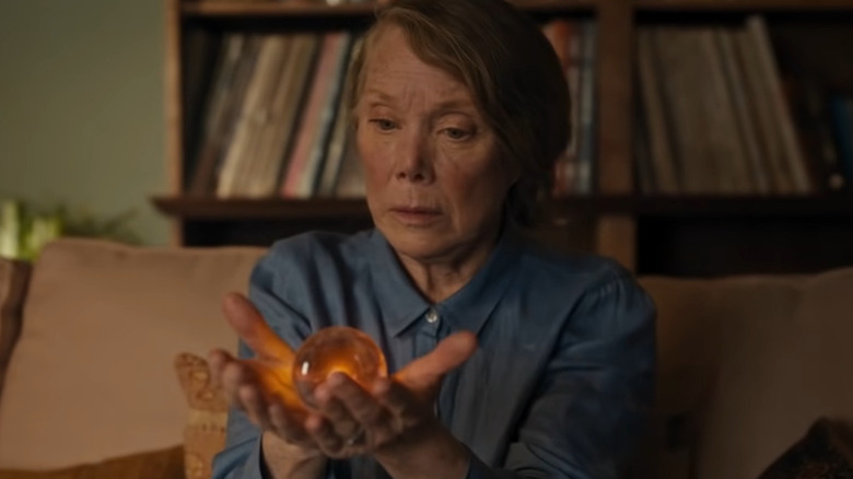 Irene York holding orange orb