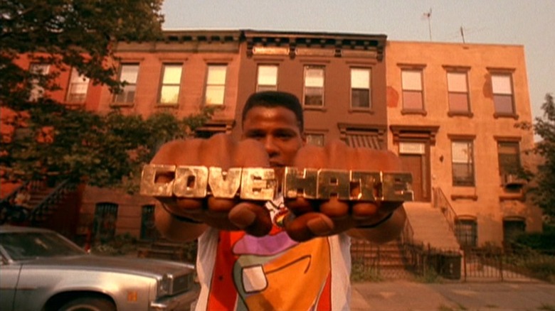 Radio Raheem posing with rings