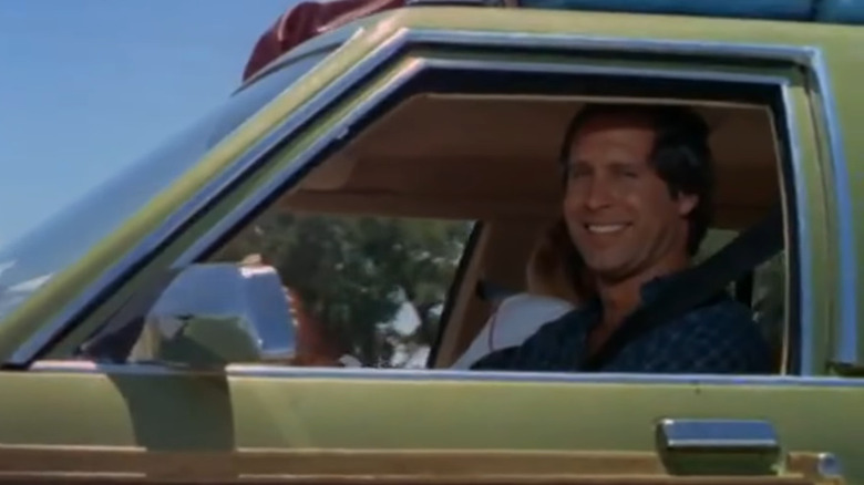 Clark Griswold smiling in car