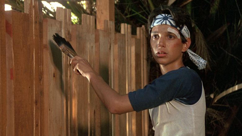 Daniel painting fence in The Karate Kid