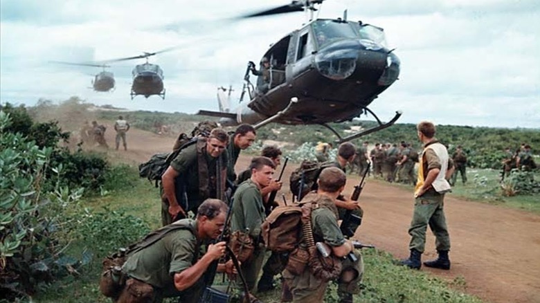 US military squad waiting for helicopter to land
