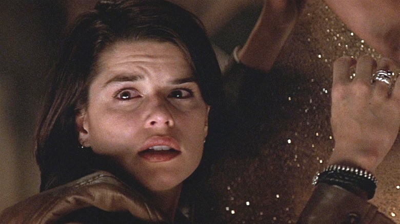 Neve Campbell looking scared