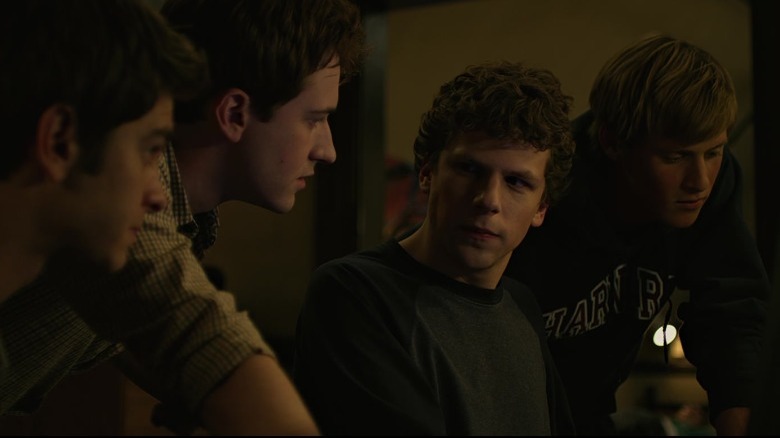 Jesse Eisenberg looking at Andrew Garfield