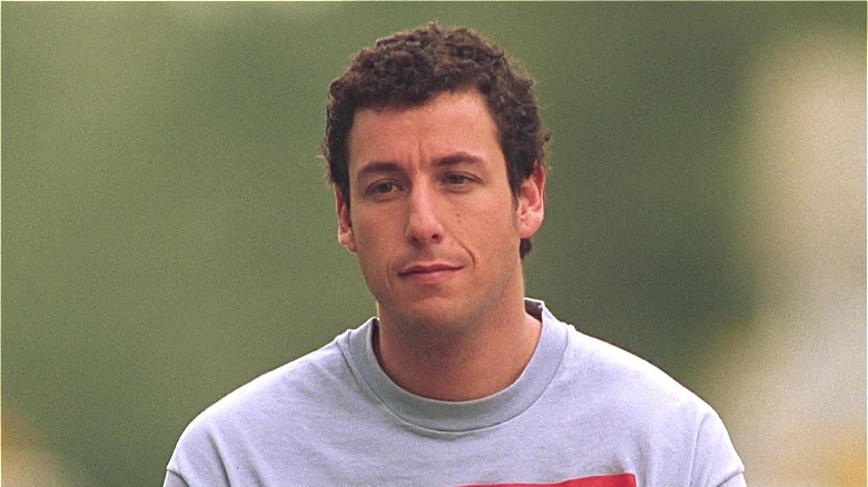 Adam Sandler wearing a gray shirt