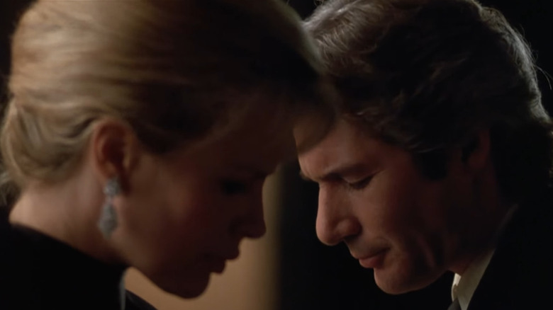 Richard Gere leans close to Kim Basinger