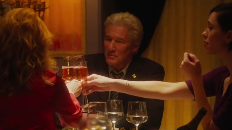 Richard Gere clinks wine glasses