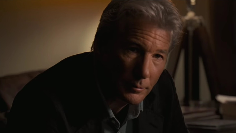 Richard Gere leans forward