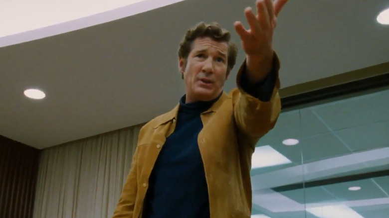 Richard Gere gestures at something off-screen