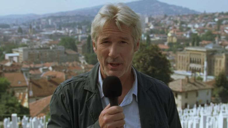 Richard Gere talks into microphone