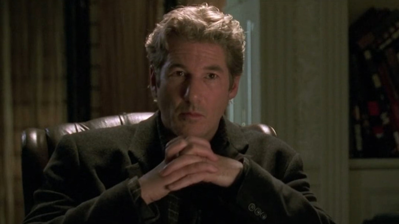 Richard Gere clasps his hands together