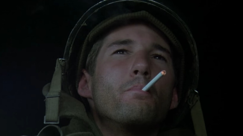 Richard Gere smokes a cigarette