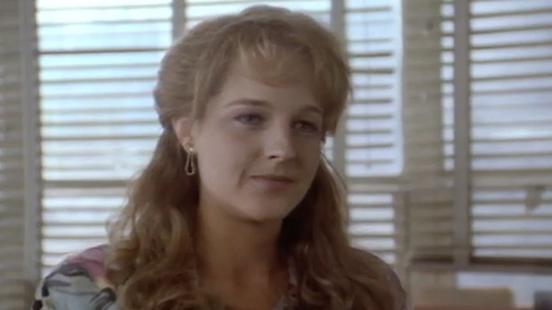 Helen Hunt lightly smiles