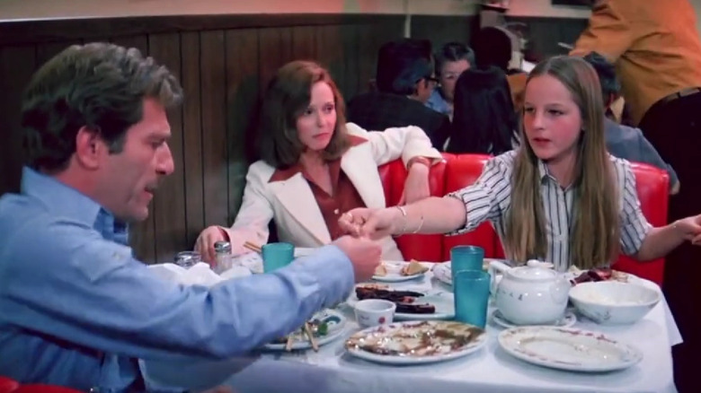 Helen Hunt at a restaurant table with George Segal