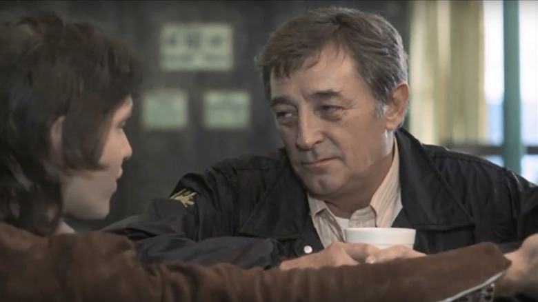 Eddie Coyle talking over coffee